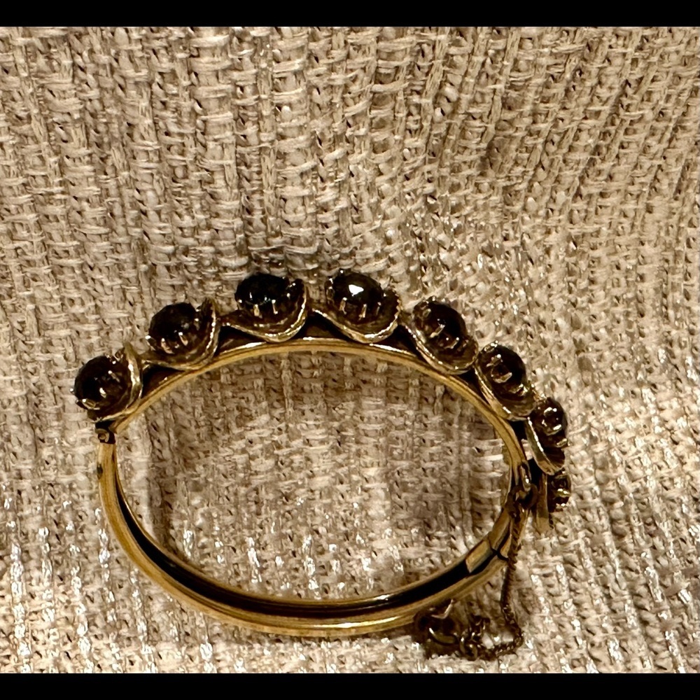 Florenza vintage hinged gold tone bracelet with garnets.